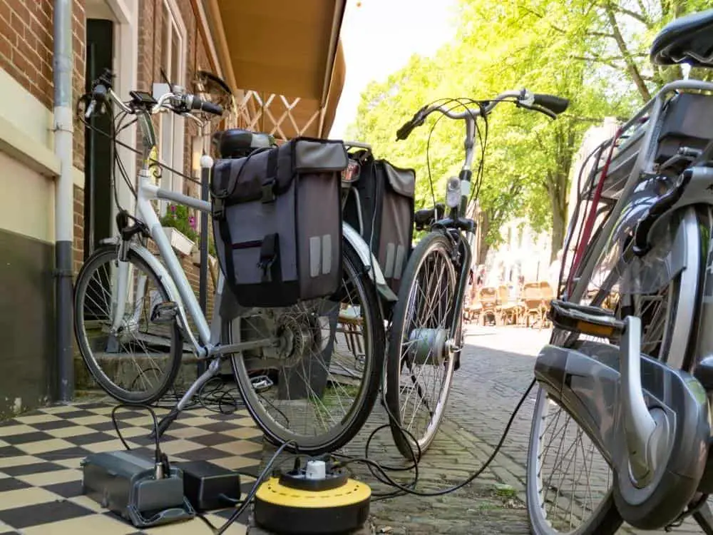 a bunch of ebikes crowded into a charging station
